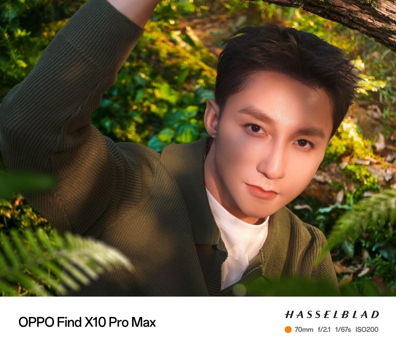 Chân dung cận của Sơn Tùng M-TP giữa rừng xanh, mép dưới ảnh có dải chữ OPPO Find X10 Pro Max và thông số Hasselblad 70mm